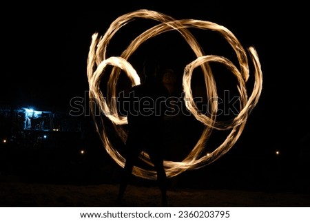 Pictures I took of a local man playing with fireballs and giving a foreshow on the beach