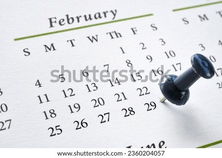 A pushpin marking Leap Year Day, February 29, on a calendar Royalty-Free Stock Photo #2360204057