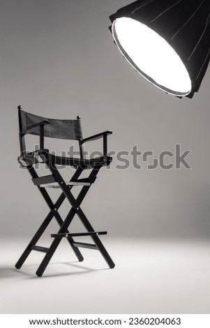 Director chair shot in studio Royalty-Free Stock Photo #2360204063