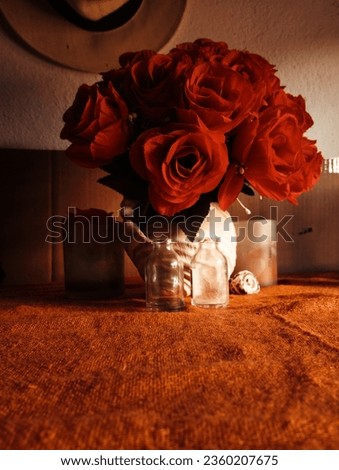 A beautiful and awesome picture of red artificial flowers with a nice background.