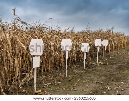 signs, signs on demo plots of corn during harvest