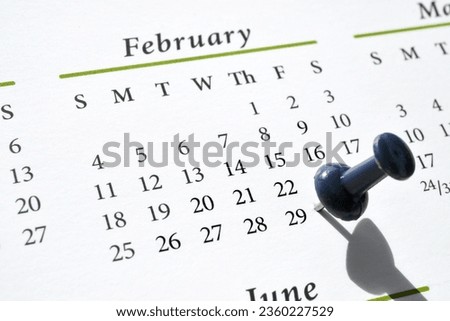 A pushpin marking Leap Year Day, February 29, on a calendar Royalty-Free Stock Photo #2360227529