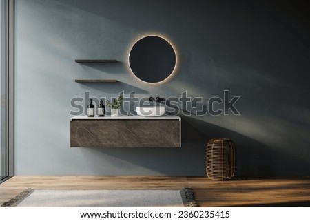 Minimal bathroom with blue tones walls, marble and white vanity, oval mirror, sink, parquet floor, and a view of the pool and sea from the window Royalty-Free Stock Photo #2360235415