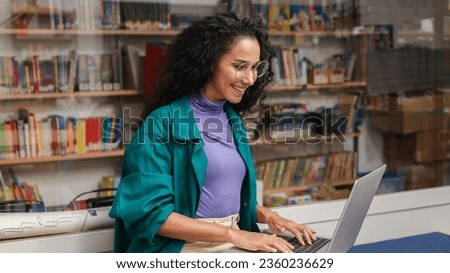 Hispanic teen girl, Latin young woman school student, remote worker learning watching online webinar webcast class looking, typing at laptop E-learning distance course or video calling remote teacher