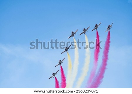 The Eagle Patrol aerobatic team of the Spanish Air Force drawing the Spain's flag in the air during the Armed Forces Day. Royalty-Free Stock Photo #2360239071