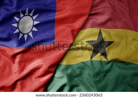 big waving national colorful flag of taiwan and national flag of ghana . macro