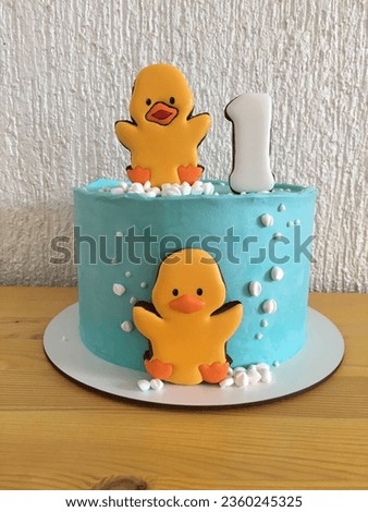 Cake for a child's birthday. Cute cake with a little duckling. Cake with a cute duckling. Cake for the first birthday