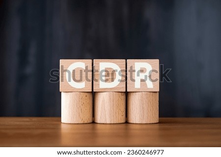 There is wood cube with the word CDR. It is an abbreviation for Carbon Dioxide Removal as eye-catching image. Royalty-Free Stock Photo #2360246977