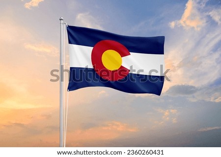 Colorado flag waving on sundown sky