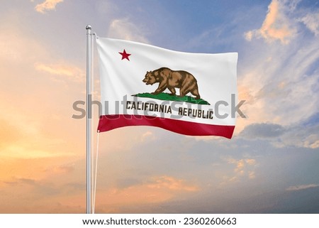 California flag waving on sundown sky