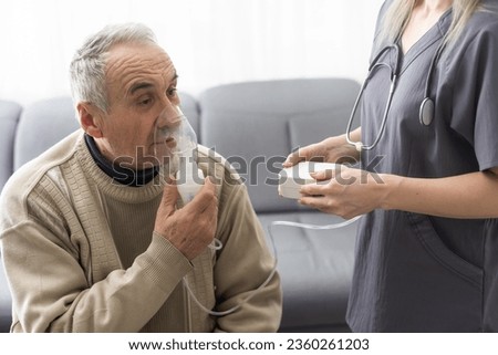 Asthma COPD Breath Nebulizer And Mask Given By Doctor Or Nurse. Royalty-Free Stock Photo #2360261203