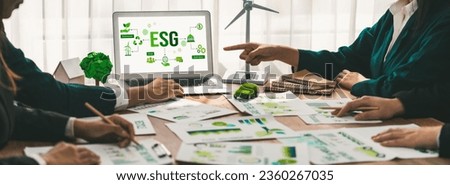 ESG environmental social governance display on laptop on eco-friendly company meeting with business people implementing environmental protection for clean and sustainable future ecology. Trailblazing Royalty-Free Stock Photo #2360267035