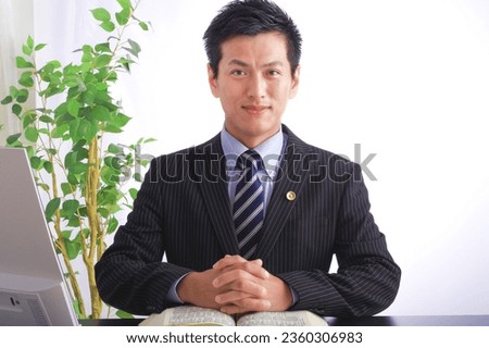 A dignified Japanese male lawyer Royalty-Free Stock Photo #2360306983