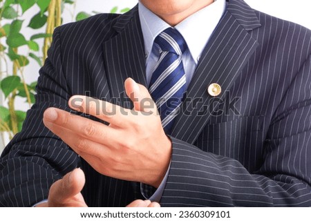 A male lawyer talking with gestures Royalty-Free Stock Photo #2360309101