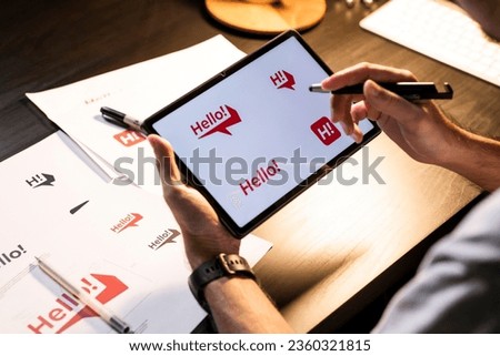 Asian man graphic designer working on computer drawing sketches logo design. The concept of a new brand. Professional creative occupation with idea. Royalty-Free Stock Photo #2360321815