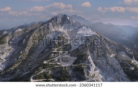 Carrara Marble Quarry - Tuscany - Italy. The scenic marble quarries in Carrara, Italy, where Michelangelo sourced materials for his famous sculptures. Aerial panorama of marble quarries Carrara. Royalty-Free Stock Photo #2360341117