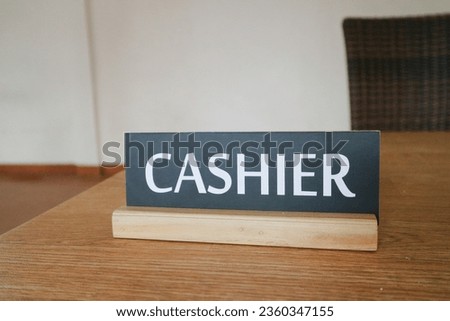 The design of the words "Cashier" was found in the cashier's room of a restaurant
