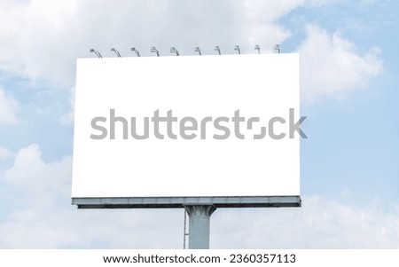 Pole outdoor billboard with blue sky background. Clipping path for mockup white screen Royalty-Free Stock Photo #2360357113