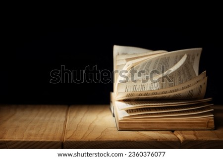 Spirituality, Religion and Hope Concept. Praying in the Dark Place. Supplication, Believe and Faith for Human. Hope in the midst of the Broken. Aged Bible on  Wooden  Table. Dark tone Royalty-Free Stock Photo #2360376077
