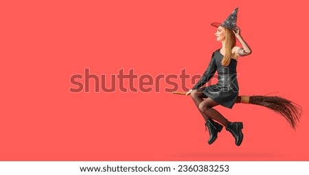 Witch flying on broom against red background with space for text Royalty-Free Stock Photo #2360383253