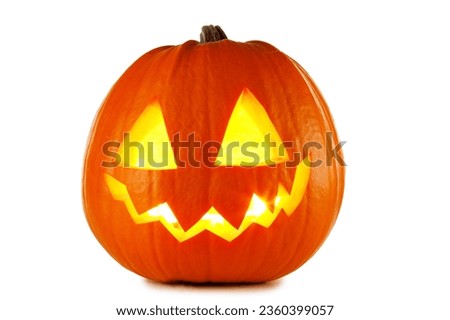 Funny Jack O Lantern halloween pumpkin with candle light inside isolated on white background Royalty-Free Stock Photo #2360399057