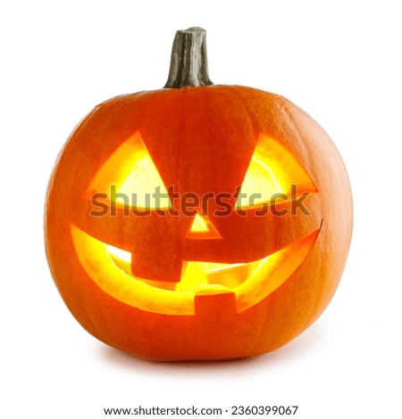 Funny Jack O Lantern halloween pumpkin with candle light inside isolated on white background Royalty-Free Stock Photo #2360399067