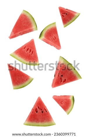 Triangular slices of ripe watermelon floating on a white background. Royalty-Free Stock Photo #2360399771