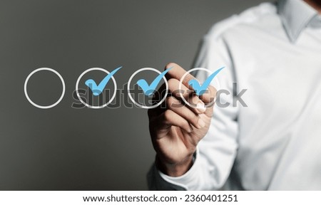 Checklist concept. Businessman Checking mark on checkboxes.