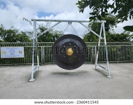 Big gong stand in the Big Buddha temple tourist attraction place in Phuket of Thailand