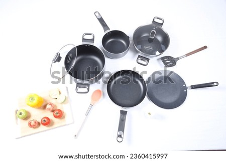 Frying pan on white table. premium Kitchen appliance. Kitchenware Stylish kitchen tools isolated close-up photo