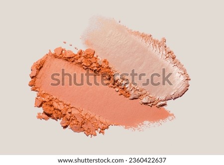 Orange peach color eye shadow matte and silky finish on beige background