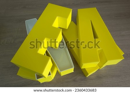 Three-dimensional letters made of plastic for the company logo.Production of outdoor advertising.