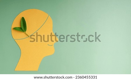 Optimistic Mind, Harmony and Environmentalism Person Concept. made by Paper and Real Green Leaf. Conceptual Photo of Mental Health Royalty-Free Stock Photo #2360455331