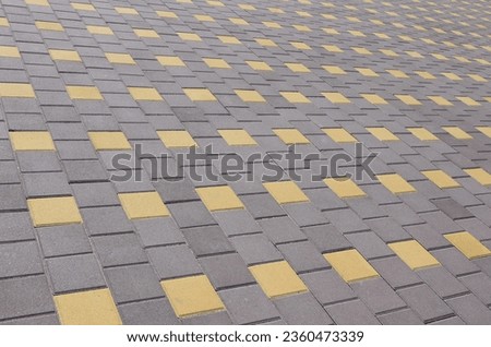 The road from the cobblestones in the town square. Background Texture in perspective
