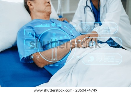 Female doctor holding male patient hand on the bed with receiving saline solution in hospital or clinic.
