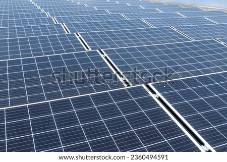 Solar panels are installed on the rooftop of the electronics engineering workshop building on a campus in Malang, Indonesia Royalty-Free Stock Photo #2360494591
