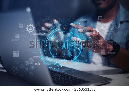 Businessmen working on laptops tap digital graphic icons AI online New business ideas in the 21 th century digital era Royalty-Free Stock Photo #2360531599