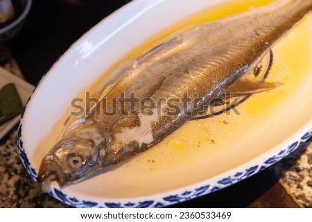 Chinese cuisine yangtse river white fish Royalty-Free Stock Photo #2360533469