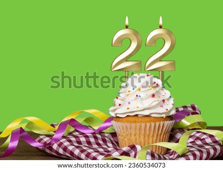 Birthday Cake With Candle Number 22 - On Green Background.
