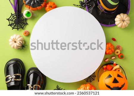 Exciting Halloween night bash for youngsters idea. High-angle snapshot of candies, kid's costume accessories, and spooky decorations on an isolated green backdrop, providing space for ads or text