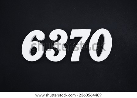 Black for the background. The number 6370 is made of white painted wood.