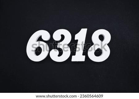 Black for the background. The number 6318 is made of white painted wood.