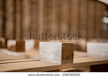 box of timber. background of pallet wood in warehouse. pattern wood section. Grid of wood squares. the raw of material timber on stack.