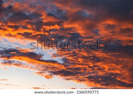 Dramatic red and orange sky above Monkey Mia, Western Australia. Red and orange colored clouds during sunset. Impressive colors during sunset. The sky looks like it is on fire during the late hours. 