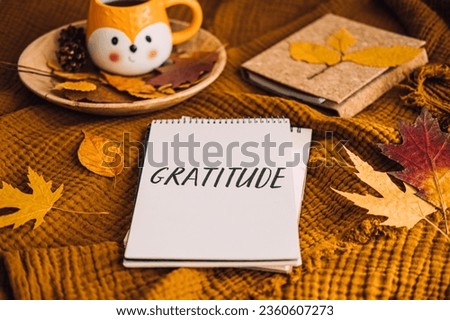 How to Practice Gratitude. Writing Autumn fall gratitude journal. Open paper notebook pages with Text gratitude and fall leaves brown bed. Notice appreciate good things, Express gratitude to yourself. Royalty-Free Stock Photo #2360607273