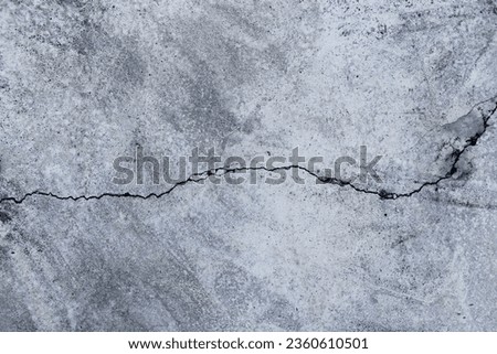 background old concrete wall that shows signs of cracking and deterioration from weather and age. Concrete backgrounds with natural textures are great for designs and include Copy Space backgrounds