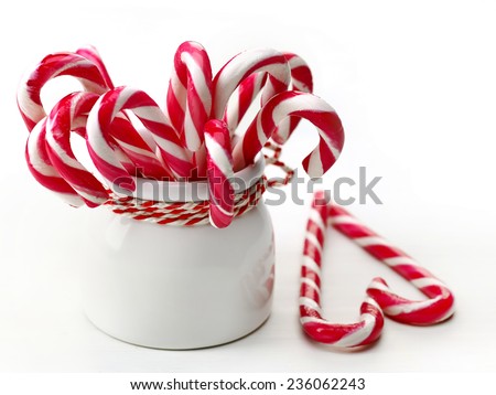 Decorative Christmas candies on white wooden table
