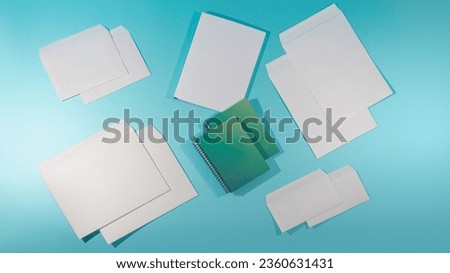 Mockups of paper envelopes and notepad without logo in different sizes