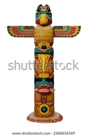 Colored totems Wooden objects symbolize plants that represent clans, families. Totem Pole Native American Southwestern Style Large Figurine Wood isolated on white background with clipping path. Royalty-Free Stock Photo #2360636569