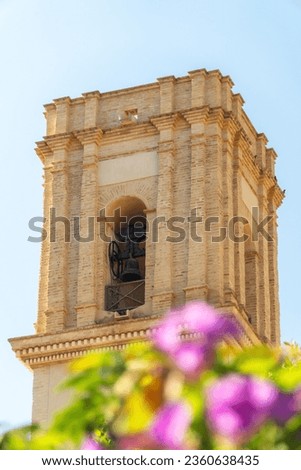 Bell tower against blue sky in Bolulla town, Alicante (Spain) 